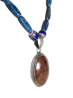 Sterling oval stone pendant on stone strand